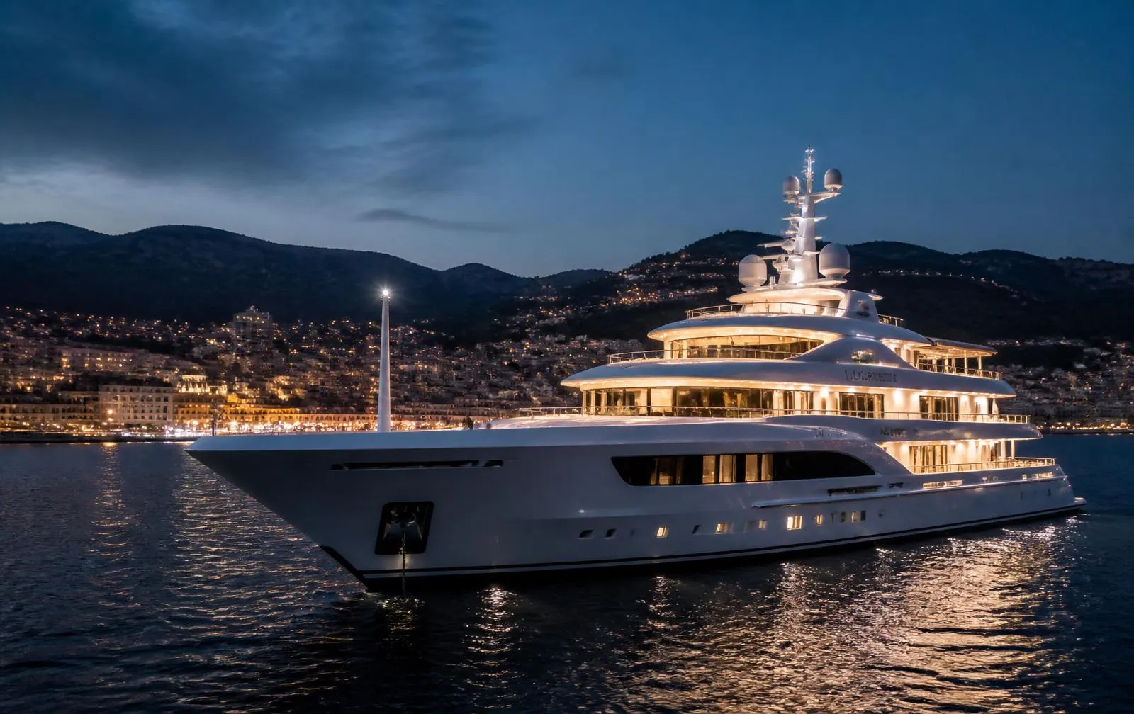 A motor yacht at anchor at dusk